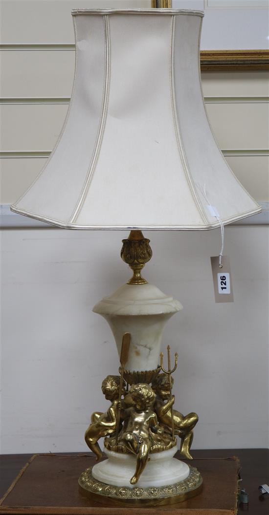 A gilt cherub lamp